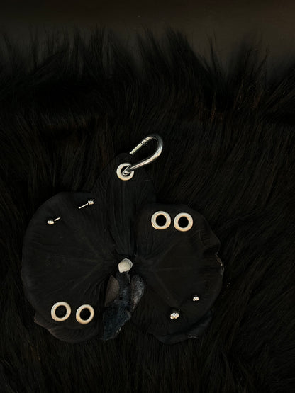 Black Pierced Orchid Keychain With Silver Hardware