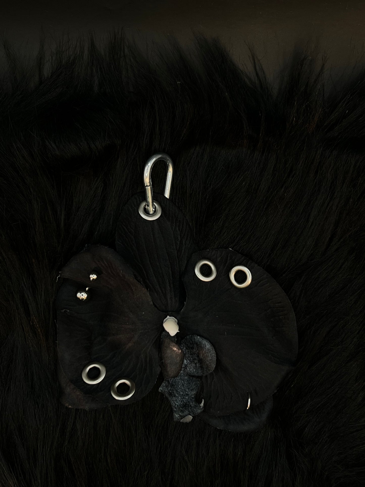 Black Pierced Orchid Keychain With Silver Hardware